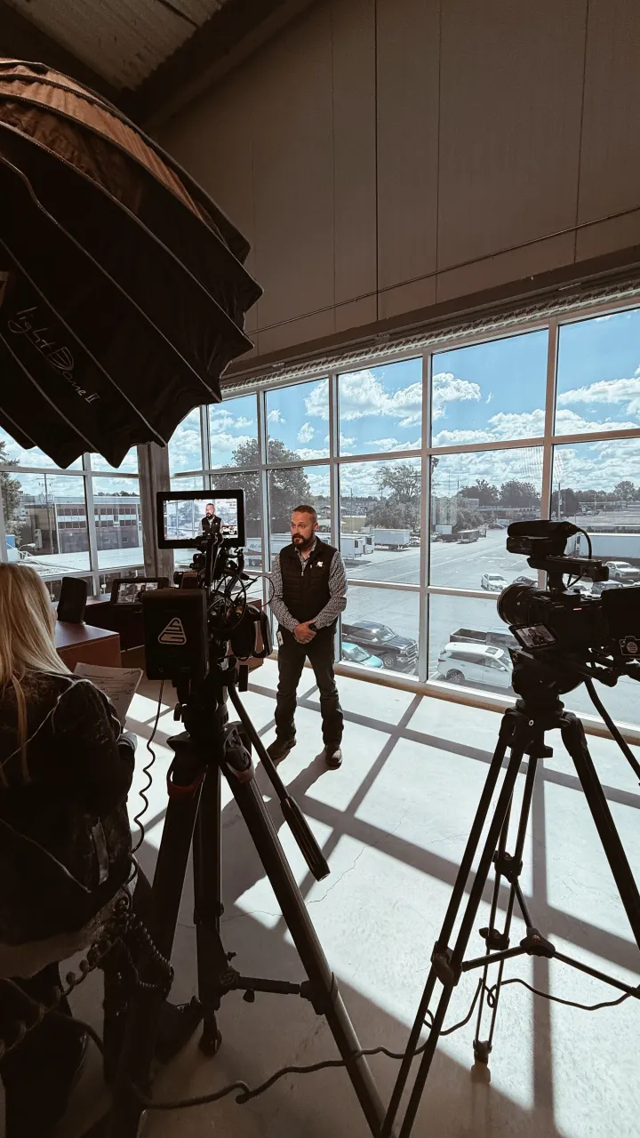 Corporate video interview filmed on location with natural window light — Hylton Media Group, Atlanta corporate video production