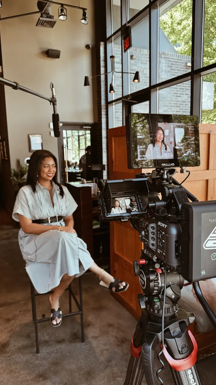 On-location corporate video interview setup with talent seated in front of camera monitors — Hylton Media Group, Atlanta corporate video production