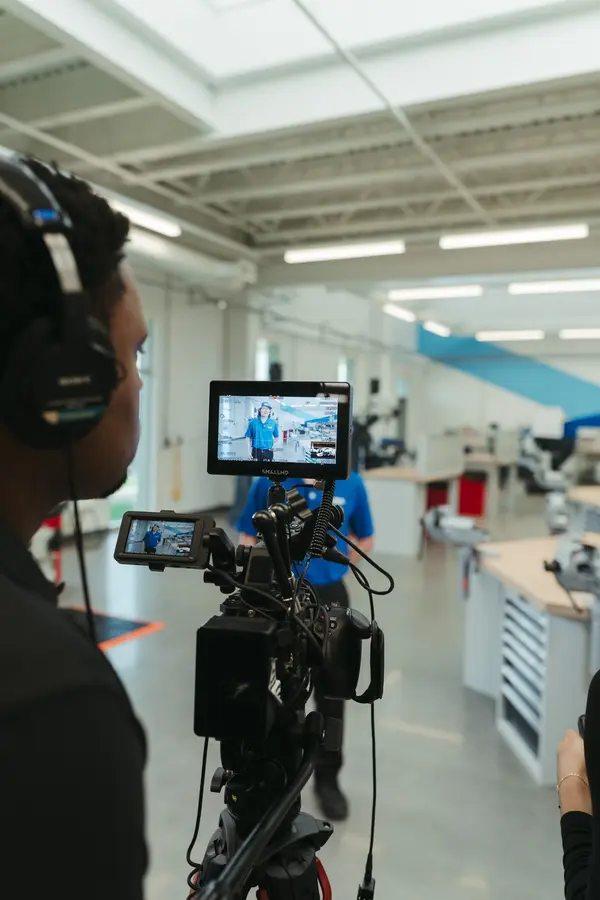Camera operator watching the monitor during an apprentice interview