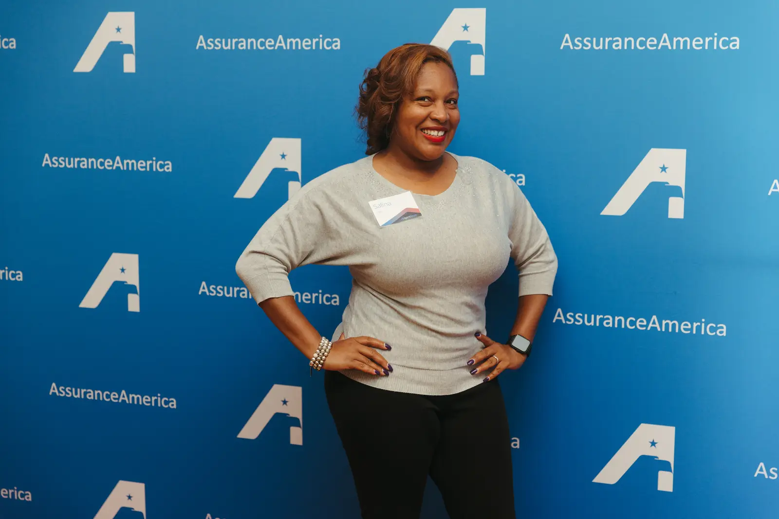 Headshot and portrait photography by Hylton Media Group in front of a branded backdrop