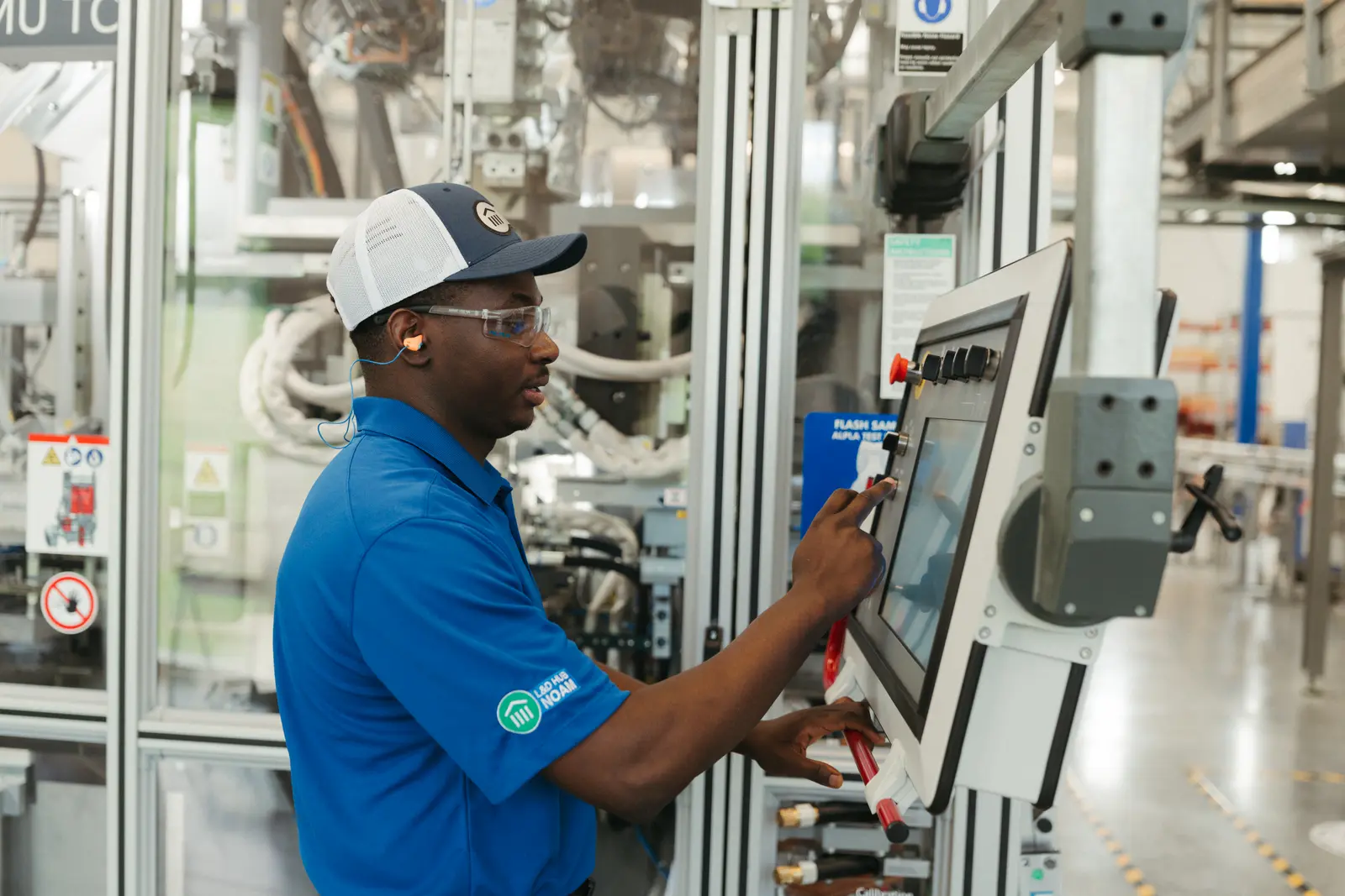 Corporate photography by Hylton Media Group: operator running equipment at a manufacturing facility