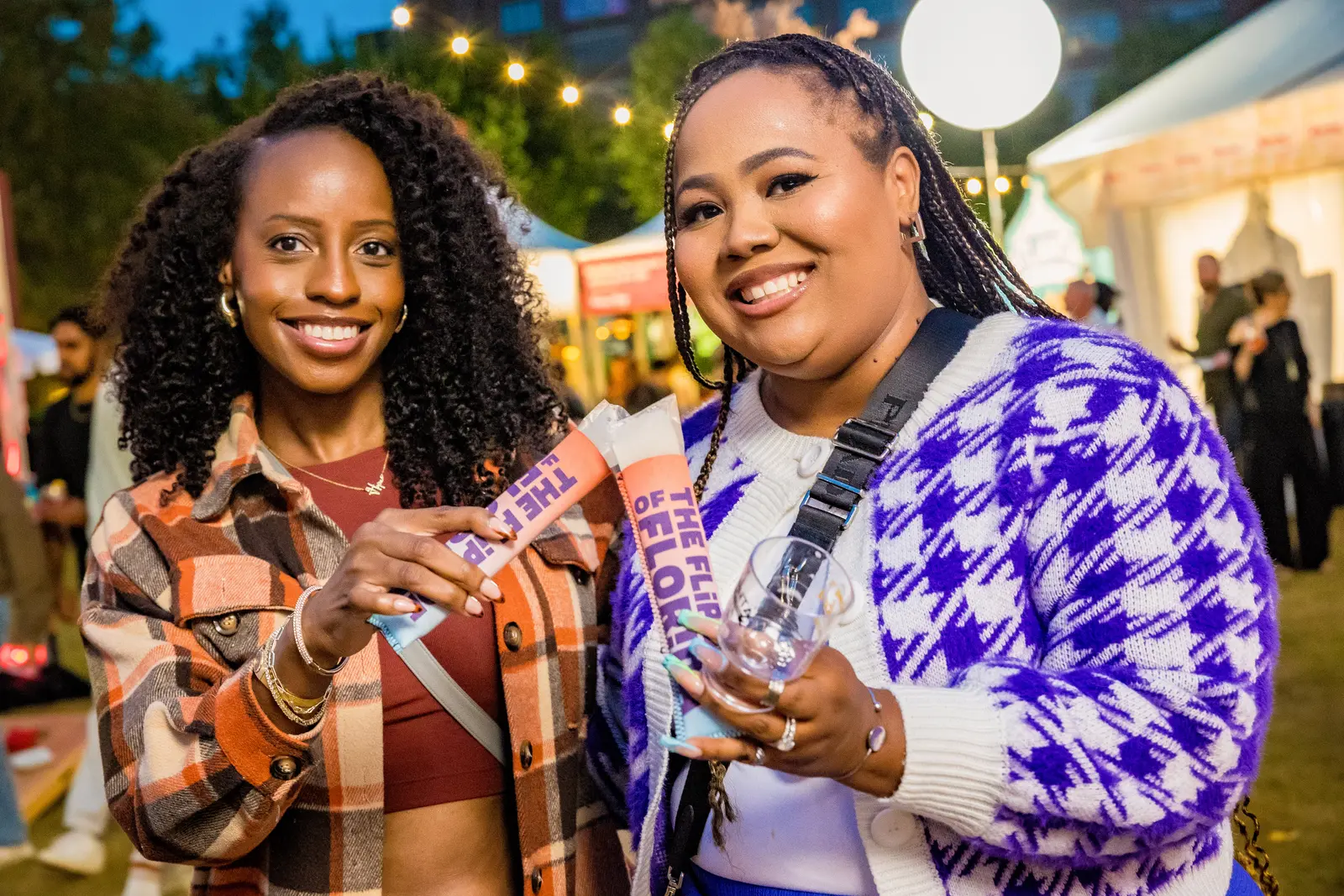 Event photography in Atlanta by Hylton Media Group: two guests at Atlanta Food & Wine Festival