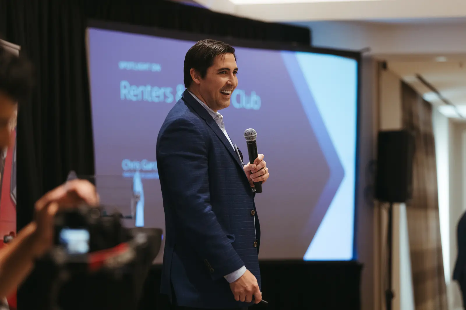 Corporate event photography by Hylton Media Group: keynote speaker on stage