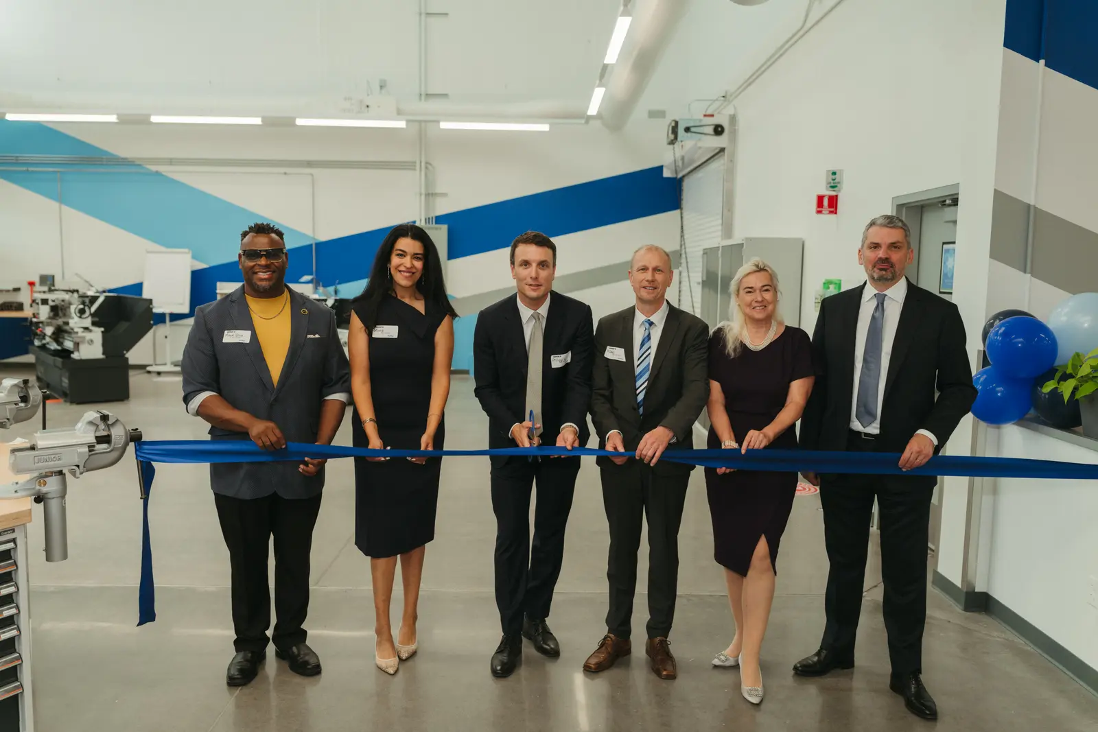 Corporate photography by Hylton Media Group: ribbon cutting at a facility opening